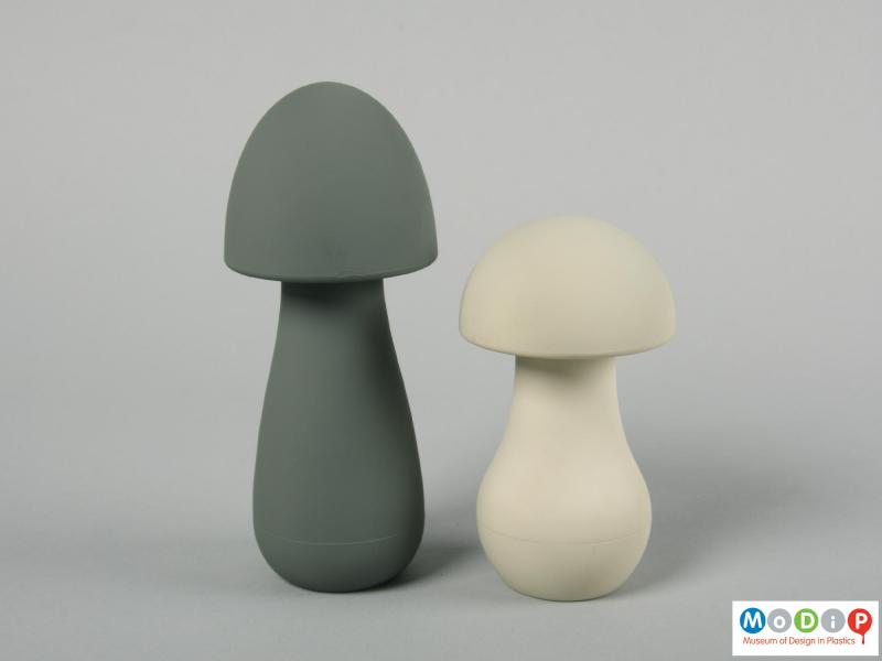 Side view of a set of salt and pepper mills showing the smooth surfaces.