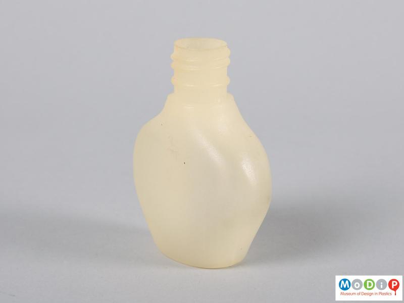 Side view of a bottle showing the texture of the material.