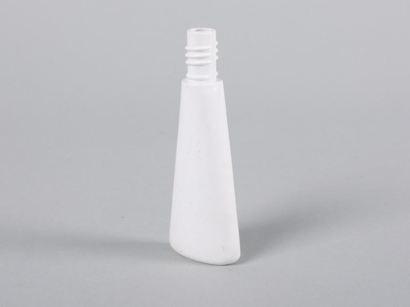 Side view of a bottle showing the tapered shape.