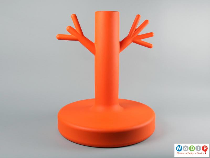 Side view of a coat rack showing the orange base.