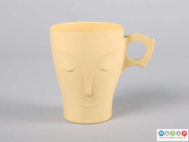 Front view of a mug showing the moulded face detail.