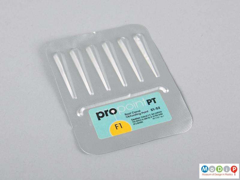 Front view of a set of obturating points showing them sealed in the packaging.