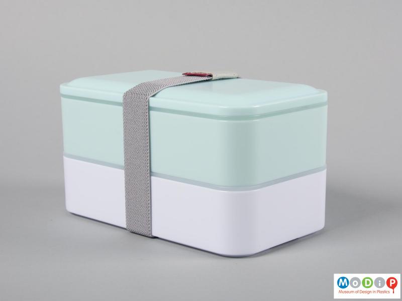 Side view of a lunch box showing the compartments held together.