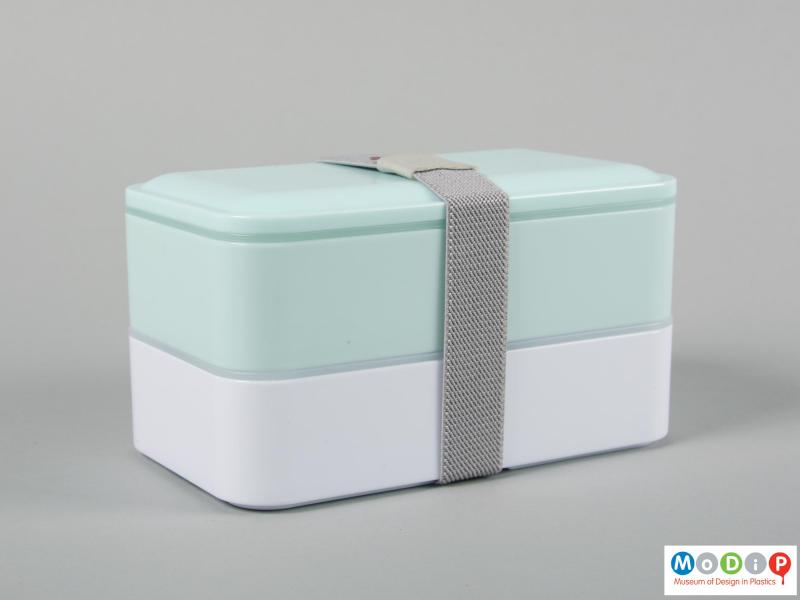 Side view of a lunch box showing the compartments held together.