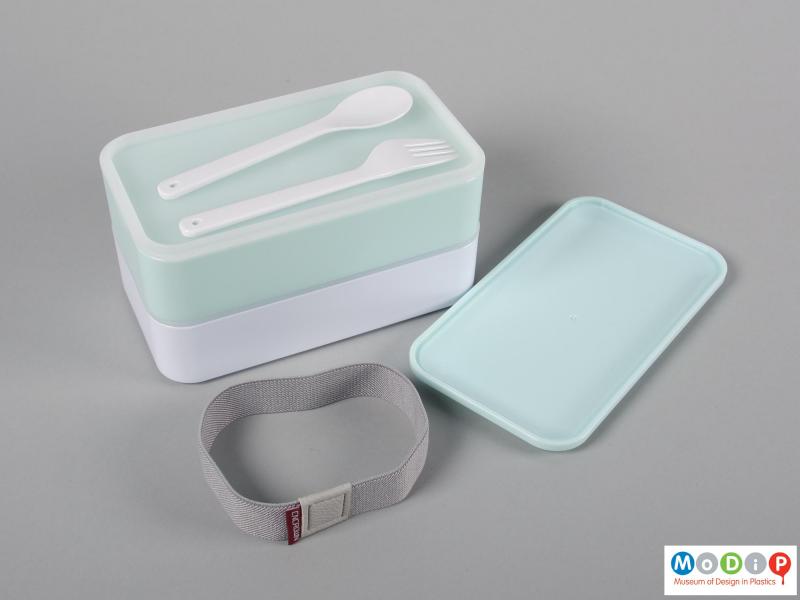 Top view of a lunch box showing the cutlery and inner surfaces.