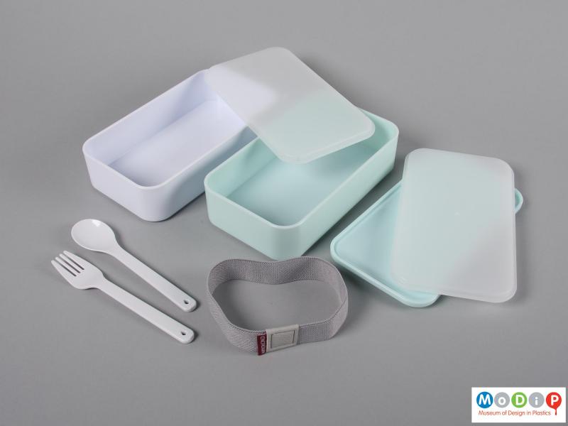 Top view of a lunch box showing the cutlery and inner surfaces.