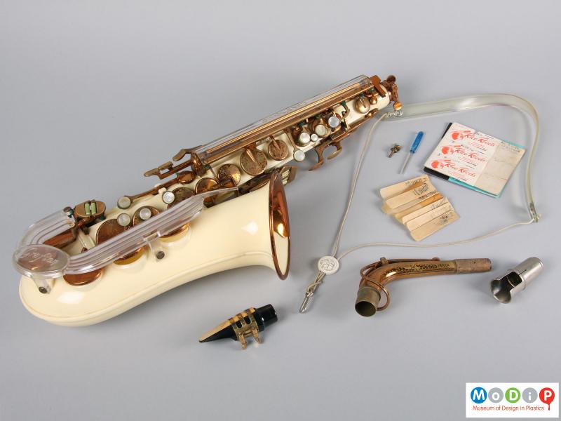 Side view of a saxophone showing the separate parts.
