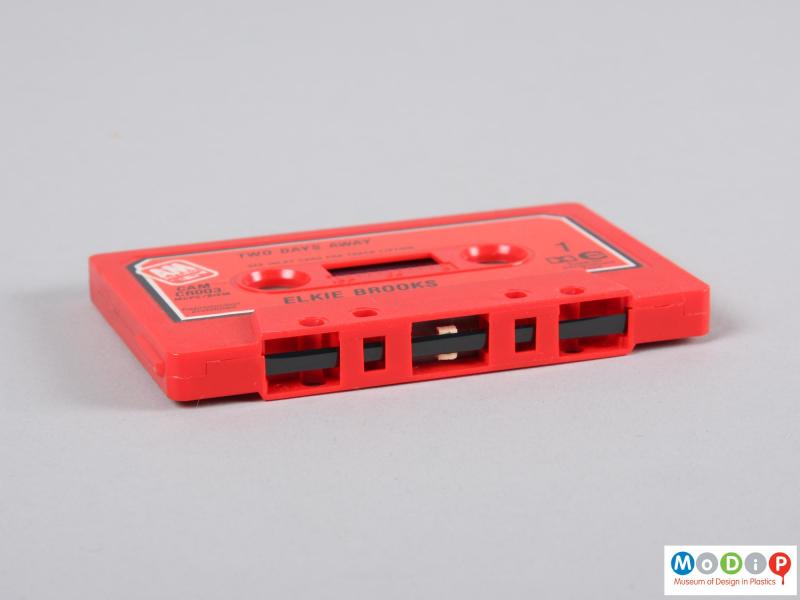 Underside view of a cassette tape showing the tape.