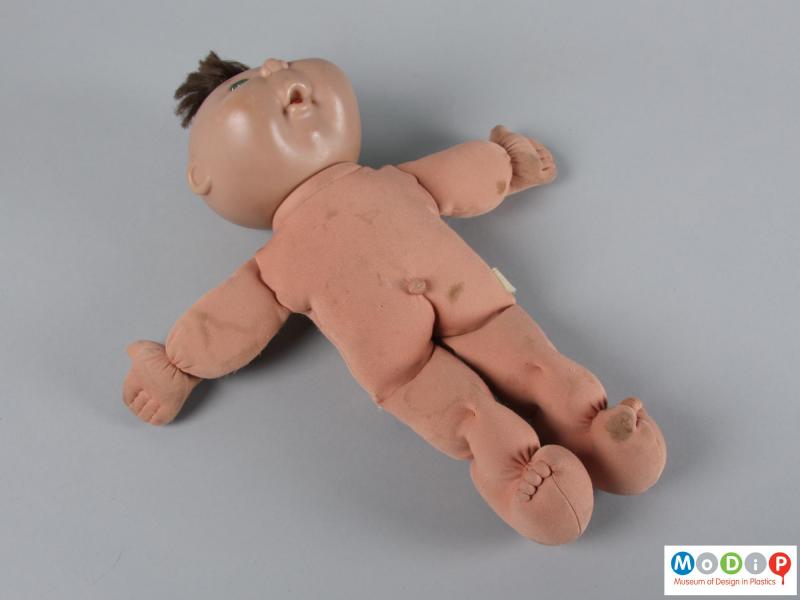 Front view of a doll showing it unclothed.
