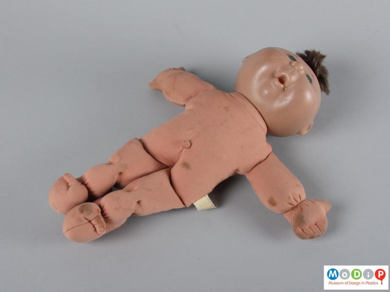 Front view of a doll showing it unclothed.