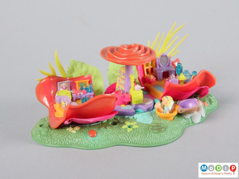 Side view of a Polly Pocket toy showing it open.