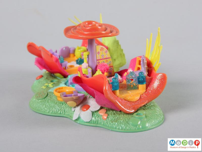 Side view of a Polly Pocket toy showing a translucent gate.