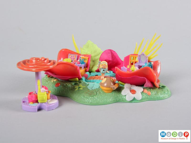 Side view of a Polly Pocket toy showing the removed central section.