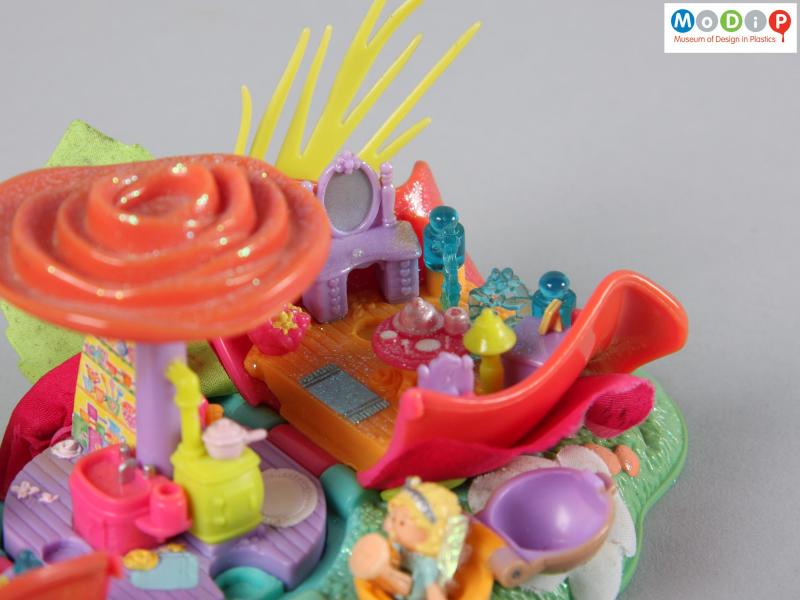 Close view of a Polly Pocket toy showing a dressing room setting.
