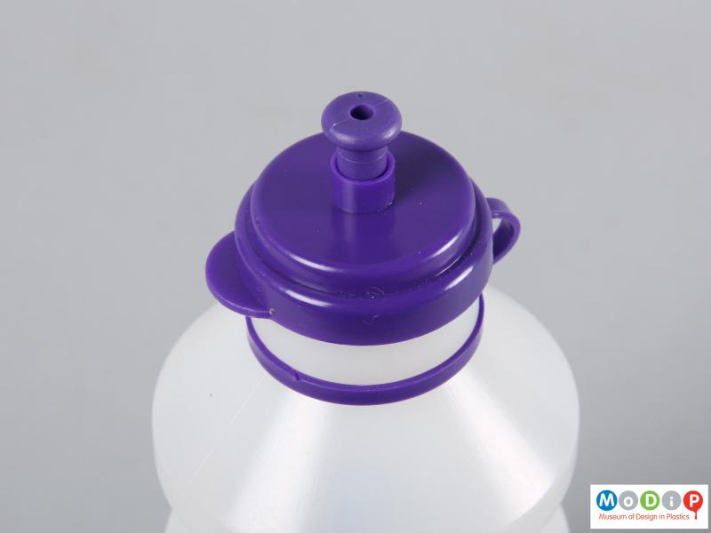 Top view of a bottle showing the open stopper.