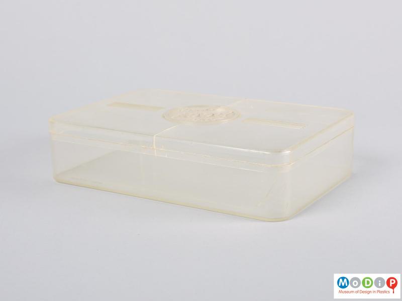 Side view of a food storage box showing the straight sides and rounded corners.