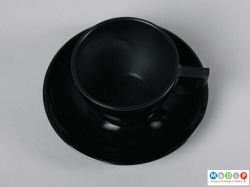 Top view of a cup and saucer showing the inner surface of the cup.