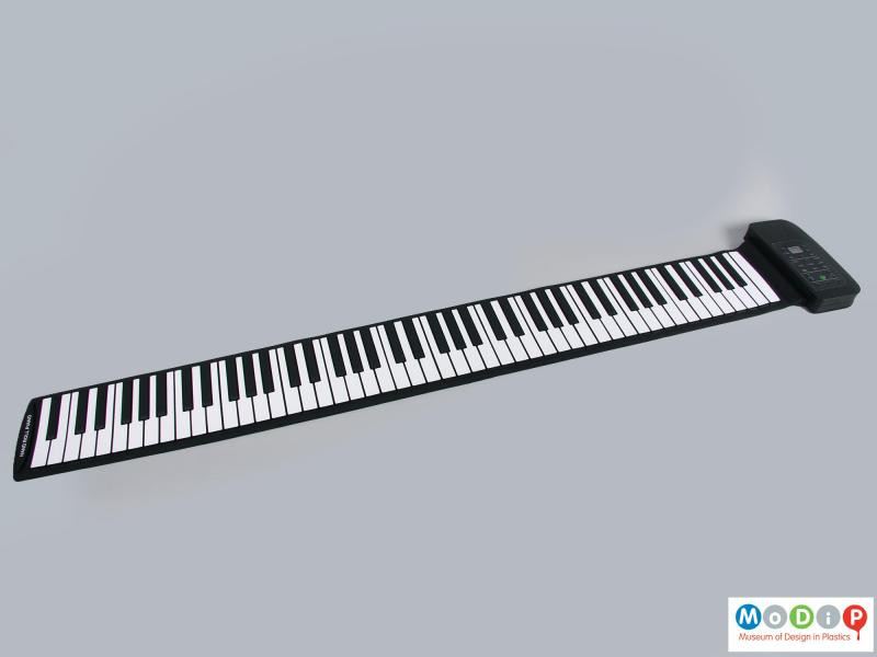 Front view of a piano showing the full length keyboard.