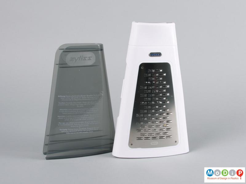 Side view of a grater showing the folded grater and protective cover.