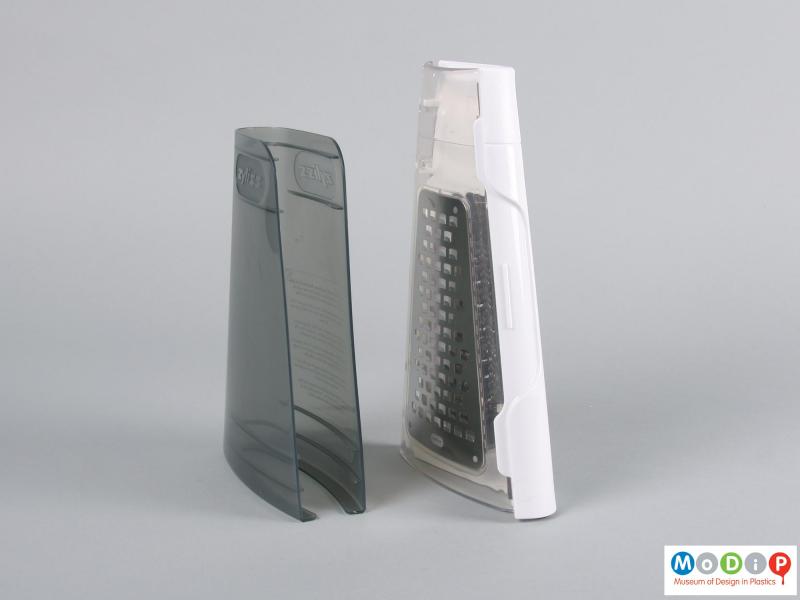 Side view of a grater showing the folded grater and protective cover.