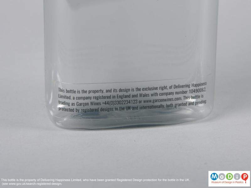 Close view of a bottle showing of the adhesive label.