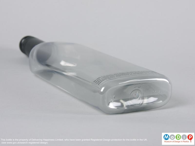 Underside view of a bottle showing the injection blow moulding gate.