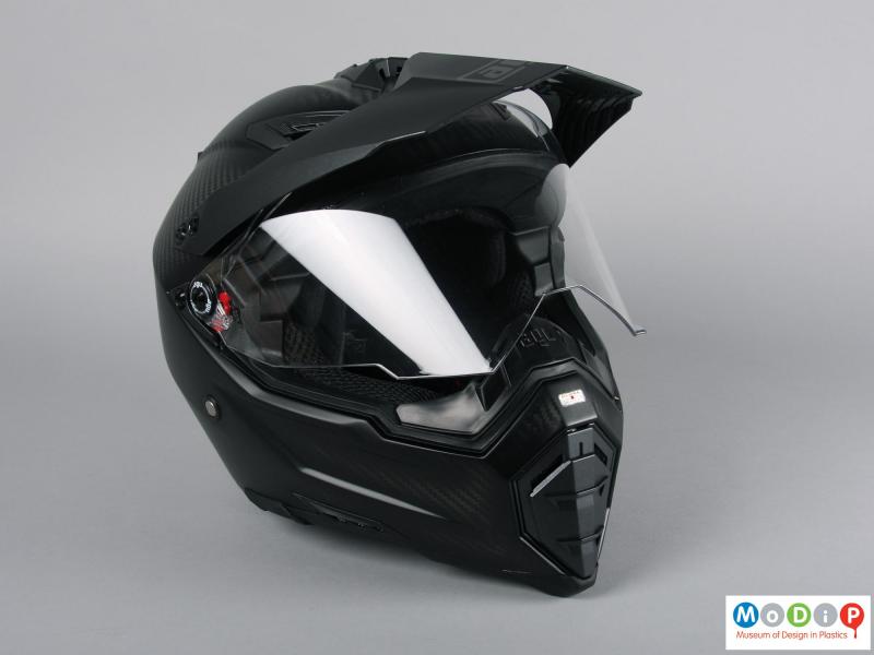Front view of a helmet showing the visor partially open.