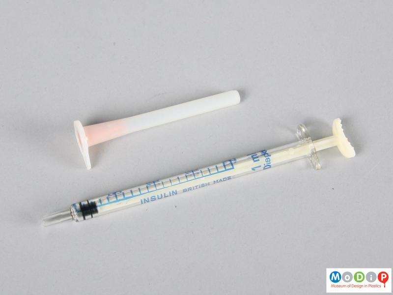 Side view of a syringe showing the plunger pushed forward.