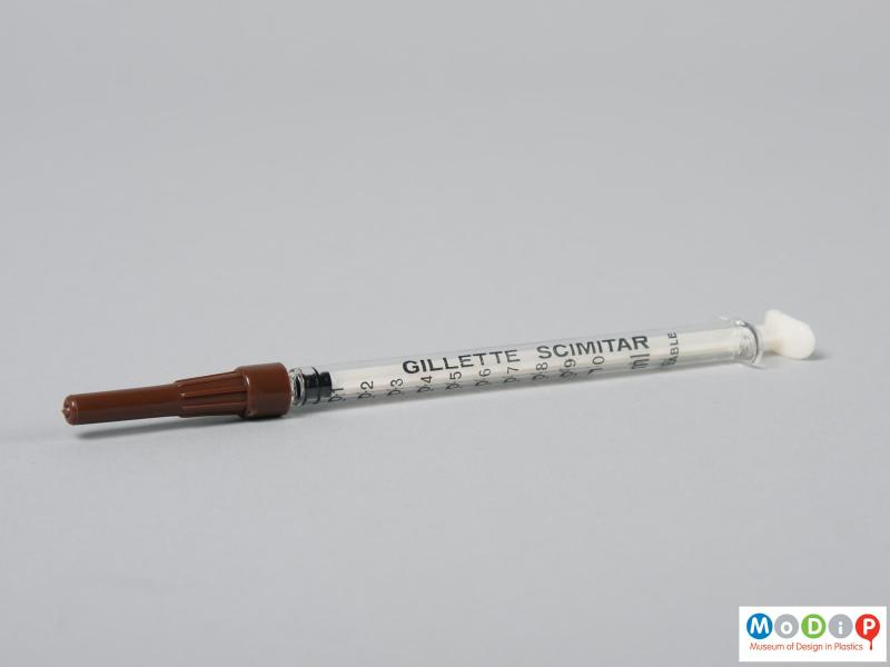 Side view of a syringe showing the plunger pushed forward.