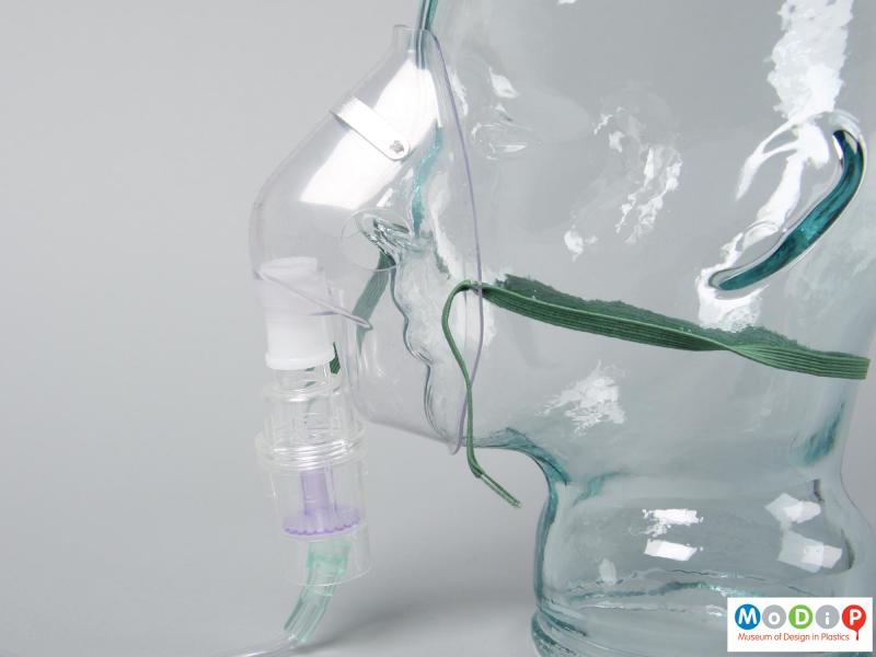 Side view of a nebuliser mask showing it with the chamber.