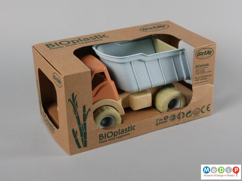 Side view of a toy truck showing the packaging.