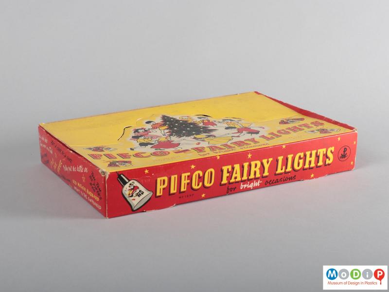 Side view of a set of fairy lights showing the packaging.
