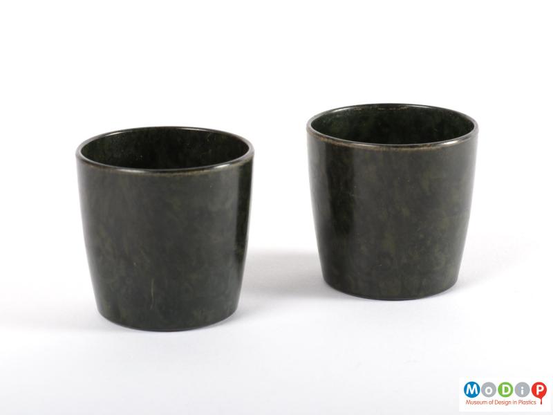 Side view of a pair of egg cups showing the straight sides.