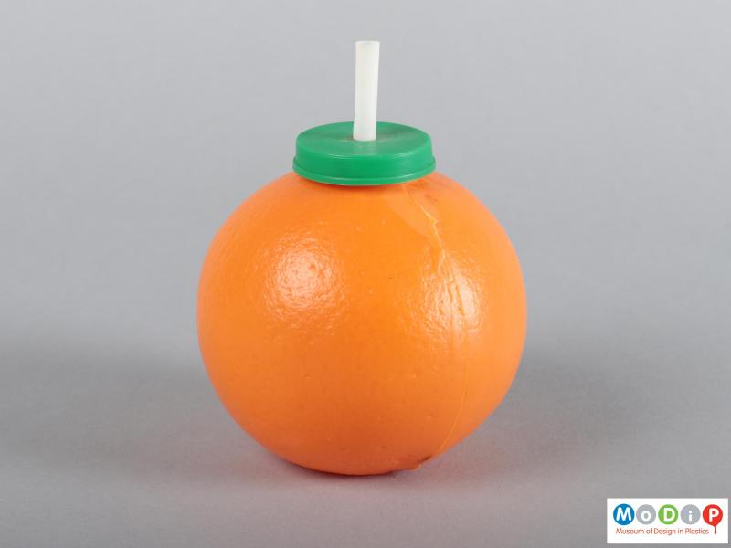 Side view of an orange drink container showing the moulding seam.