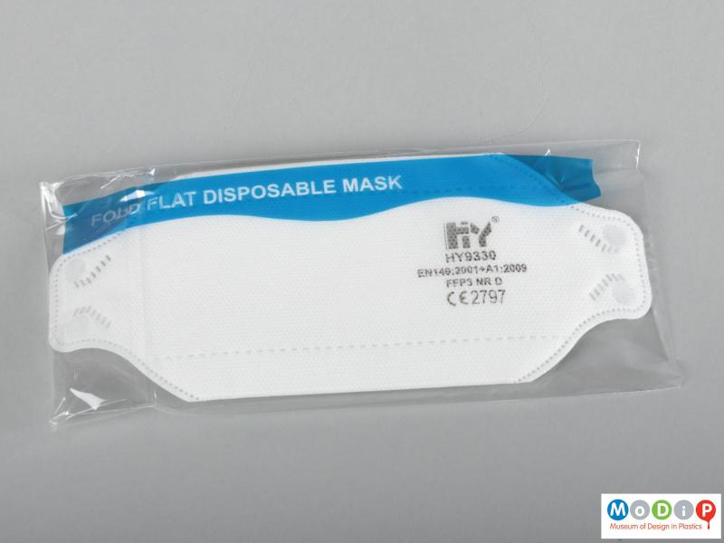 Front view of a face mask showing the individual packaging.