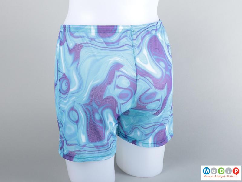 Rear view of a pair of swim shorts showing the printed pattern.