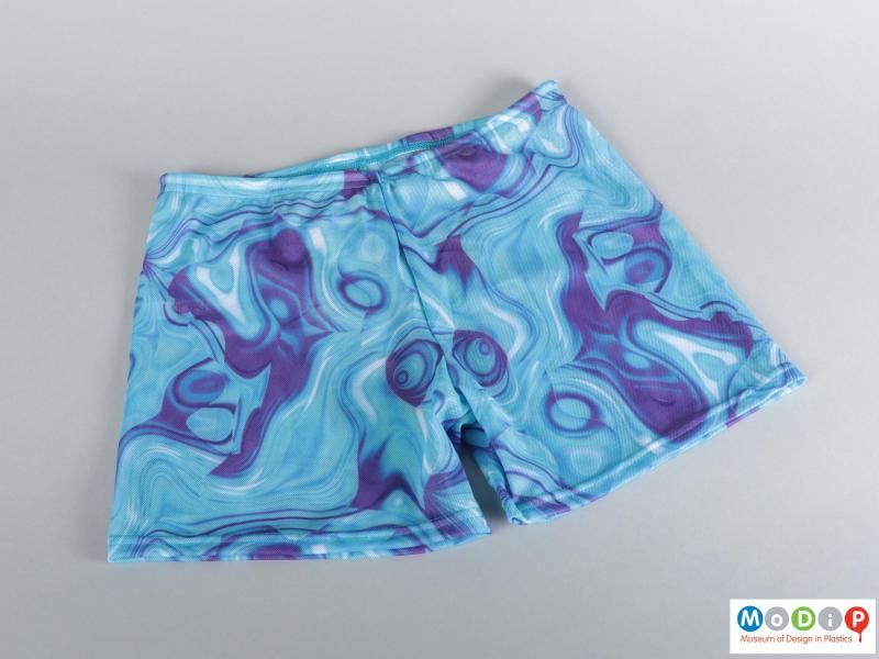 Front view of a pair of swim shorts showing the printed pattern.