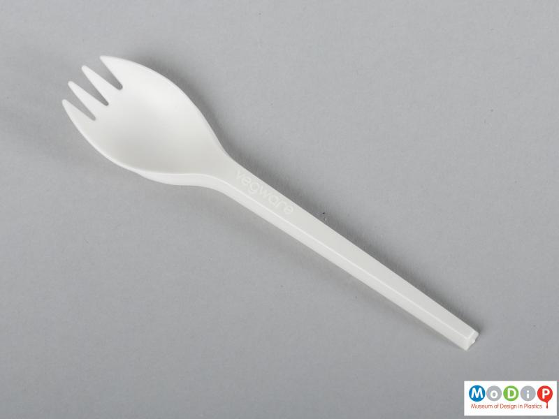 Top view of a spork showing the round fork head.