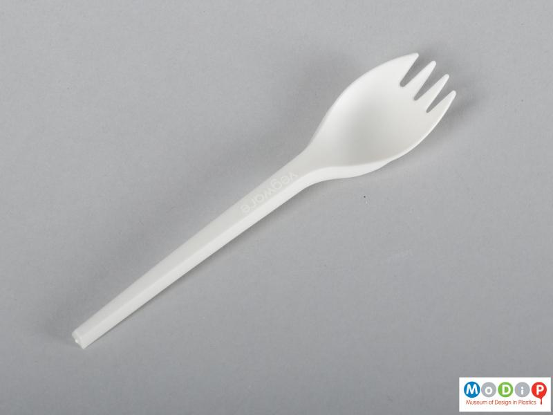 Top view of a spork showing the straight and tapered handle.