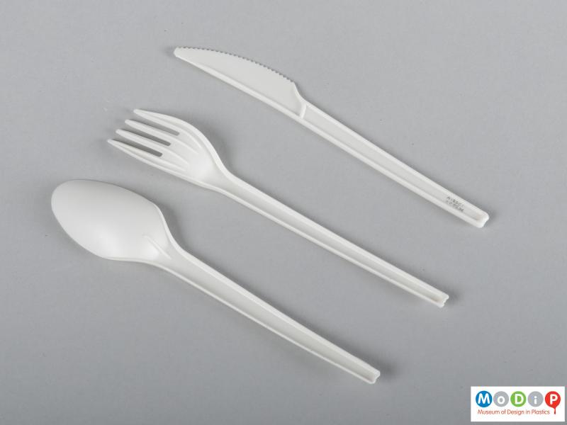 Underside view of a cutlery set showing the straight and tapered handles.
