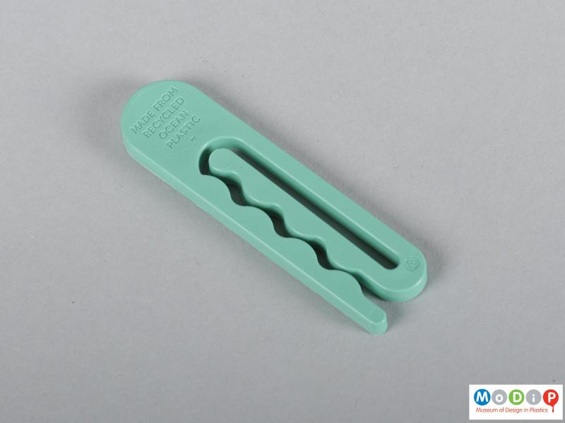 Rear view of a clothes peg showing the wave design.