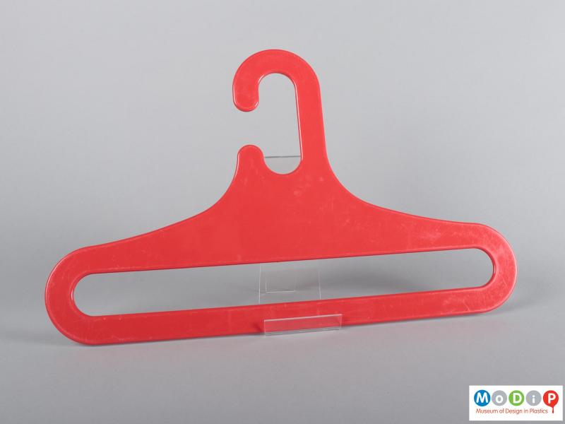 Rear view of a coat hanger showing the sloping shoulders.
