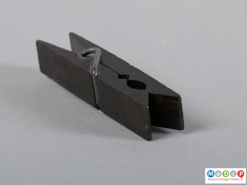 Side view of a clothes peg showing the grip end.