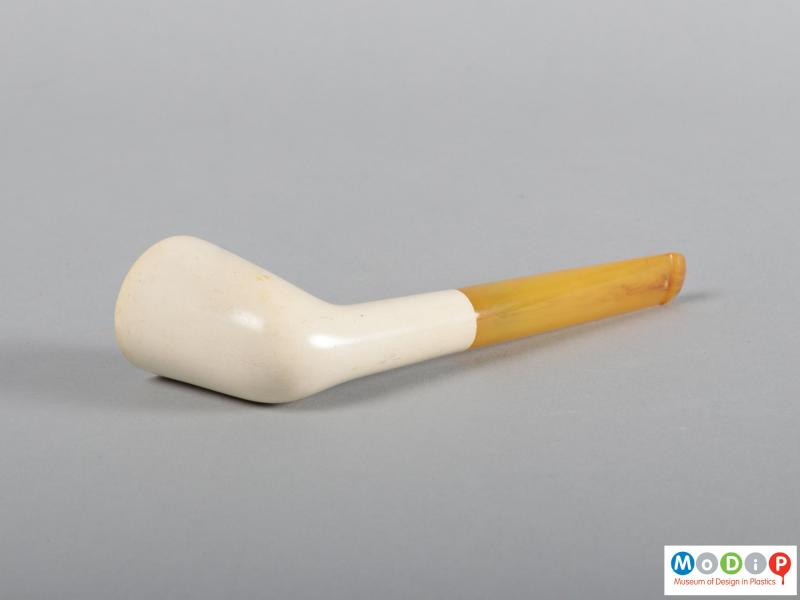 Underside view of a smoking pipe showing the round bowl.