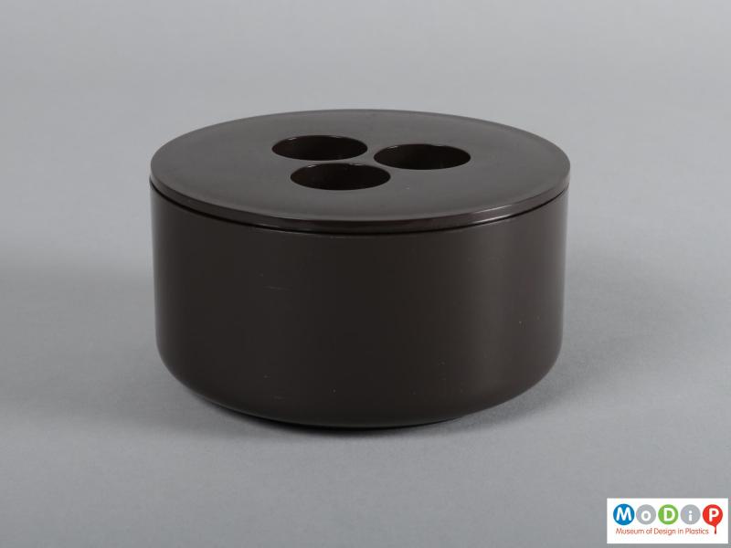 Side view of a container showing the low cylindrical shape.
