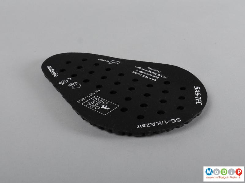 Side view of a protective pad showing the rounded shape.