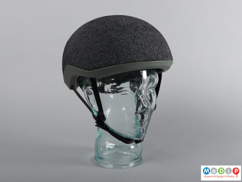 Front view of a cycle helmet showing the fabric covering.
