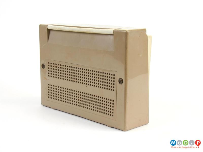 Rear view of a Philips L3G03T transistor radio showing a removable rectangular grill on the back along with the folded down handle at the top.