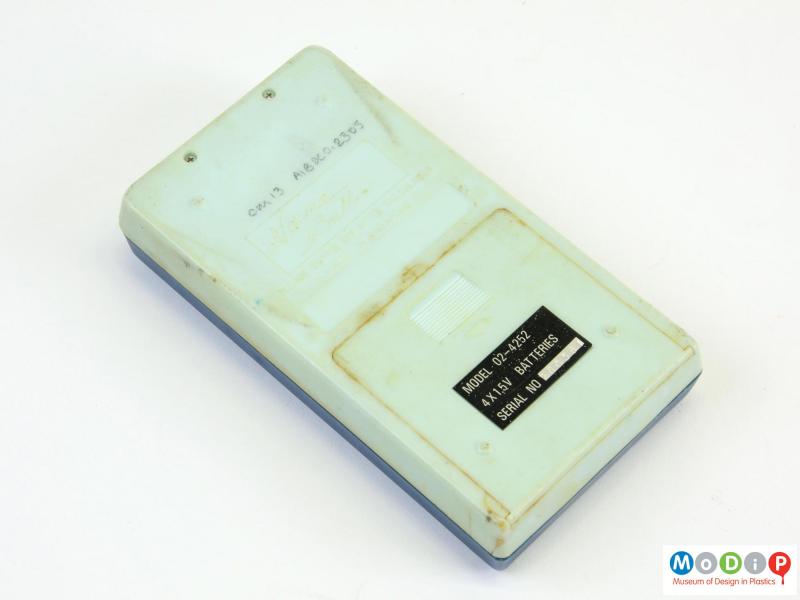 Underside view of a Binatone 02 4252 calculator showing the removable batetry cover, moulded information and model sticker.