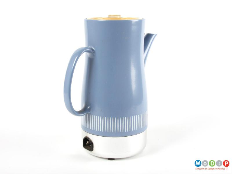 Side view of a coffee pot showing the plug socket for the cable.